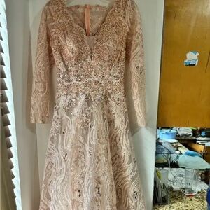 Rose gold/ pinkish dress from the Middle East.